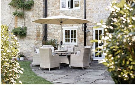 Bramblecrest Chedworth Rattan 6 Seat Round Dining Set with Lazy Susan, Parasol and Base - Sandstone Bramblecrest Chedworth Rattan 6 Seat Round Dining Set with Lazy Susan, Parasol and Base - Sandstone